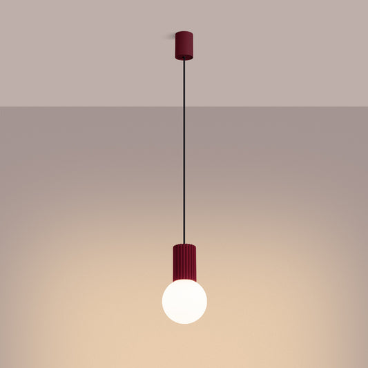 Burgundy Opal Glass Globe Pendant Light switched on in modern UK home interior, warm LED glow