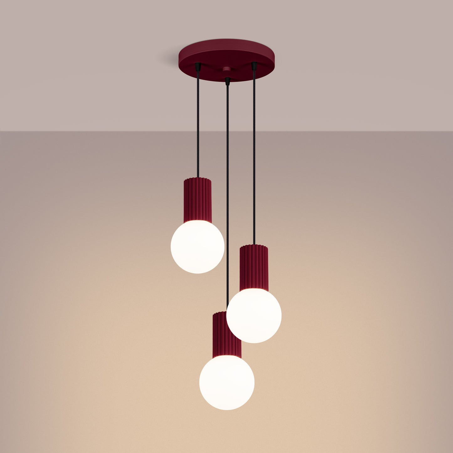 Burgundy Triple Glass Globe Pendant Cluster switched on in modern UK home interior, warm LED glow