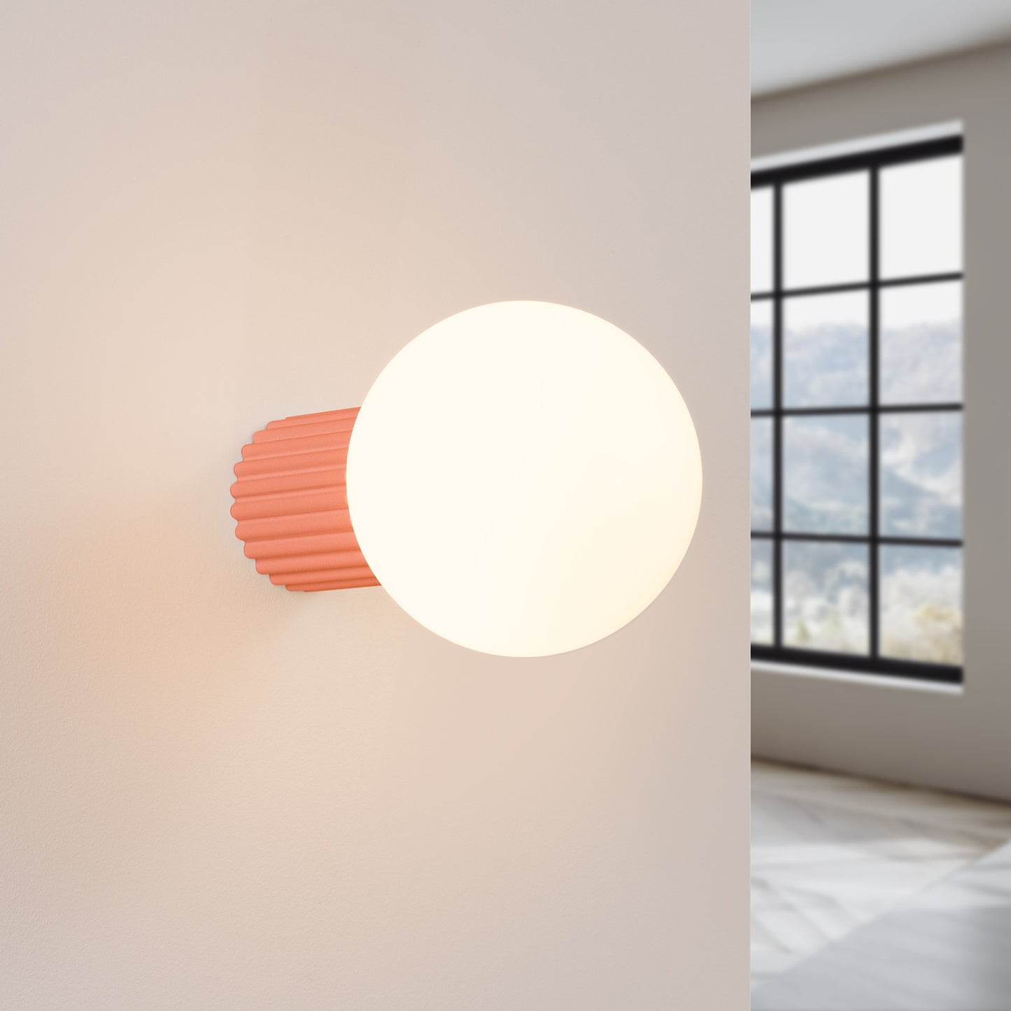 Peach Opal Glass Globe Wall Light IP44 switched on in modern UK home interior, warm LED glow