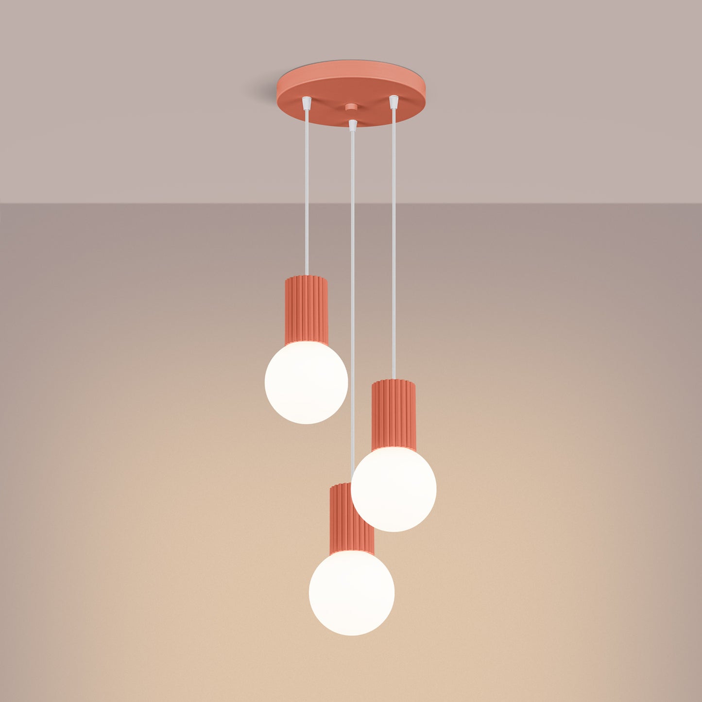 Peach Triple Glass Globe Pendant Cluster switched on in modern UK home interior, warm LED glow