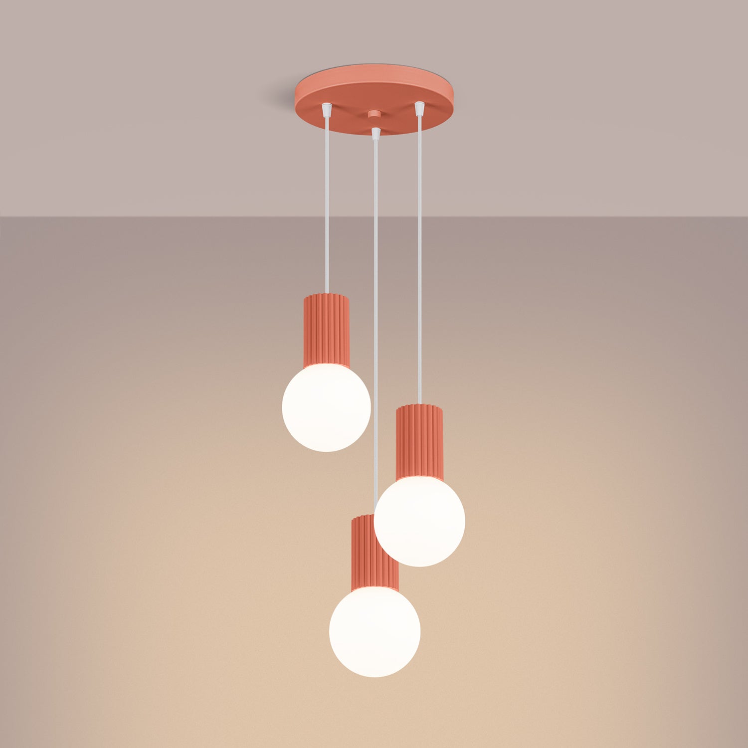 Peach Triple Glass Globe Pendant Cluster switched on in modern UK home interior, warm LED glow