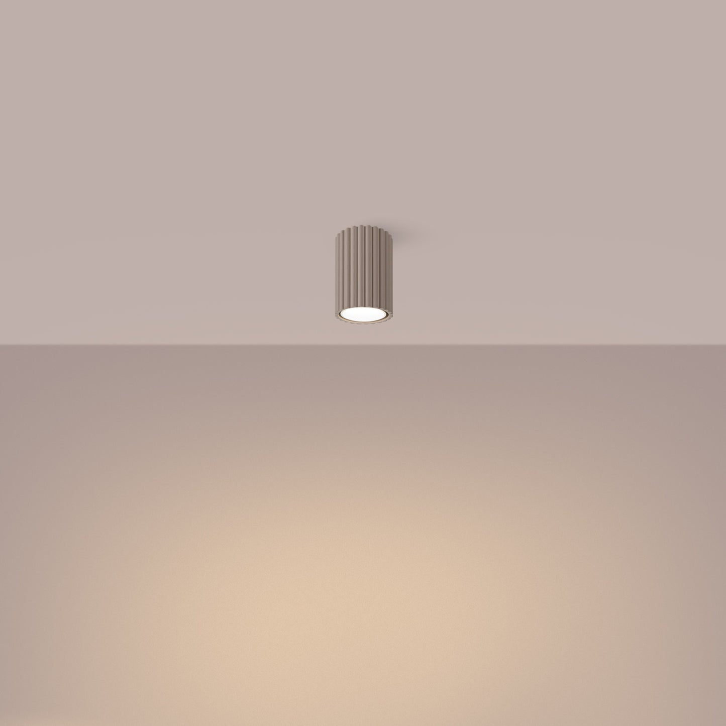 Taupe Ribbed Surface Spotlight switched on in modern UK home interior, warm LED glow