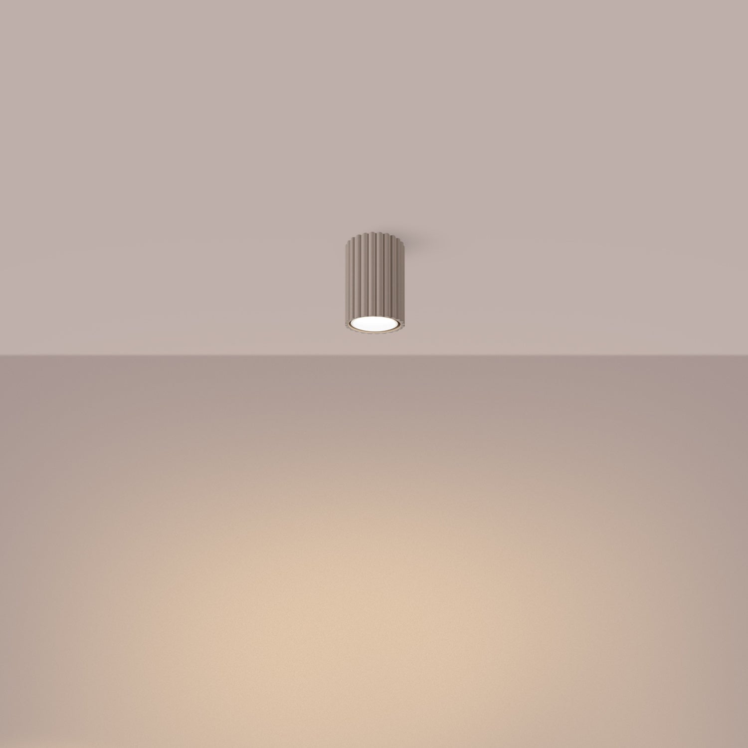 Taupe Ribbed Surface Spotlight switched on in modern UK home interior, warm LED glow