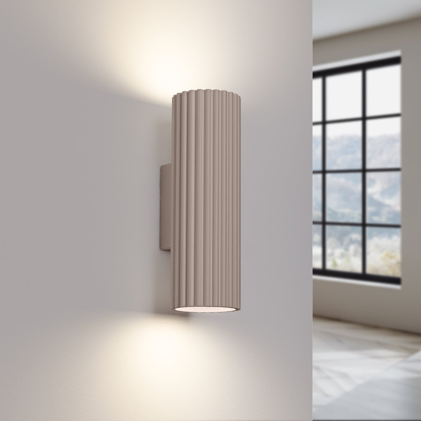 Taupe Ribbed Up Down Wall Light switched on in modern UK home interior, warm LED glow