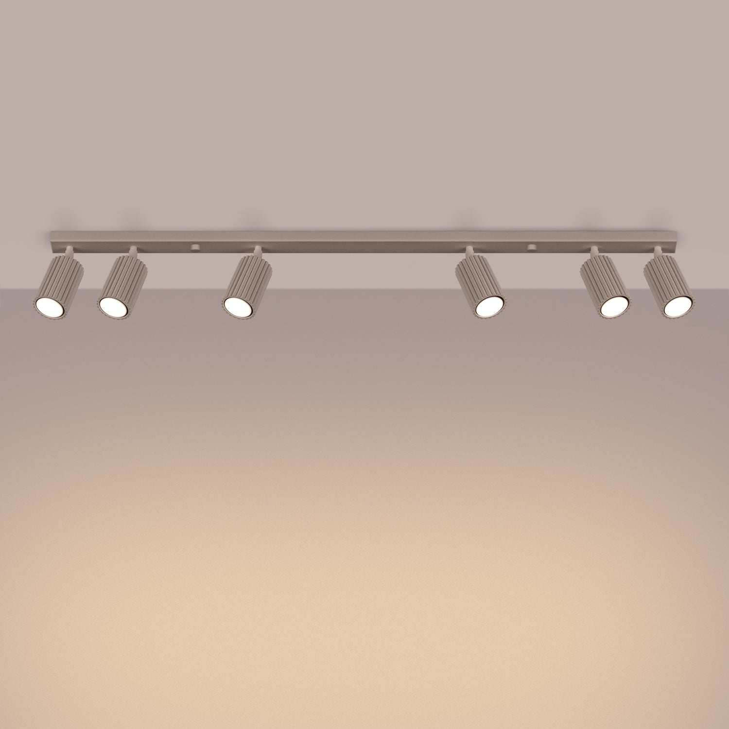 Taupe Six Light Ribbed Spotlight Bar switched on in modern UK home interior, warm LED glow