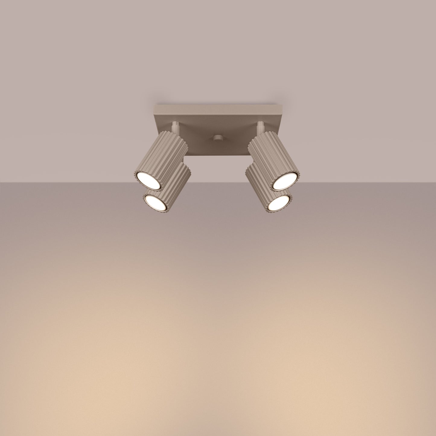 Taupe Quad Ribbed Spotlight Cluster switched on in modern UK home interior, warm LED glow