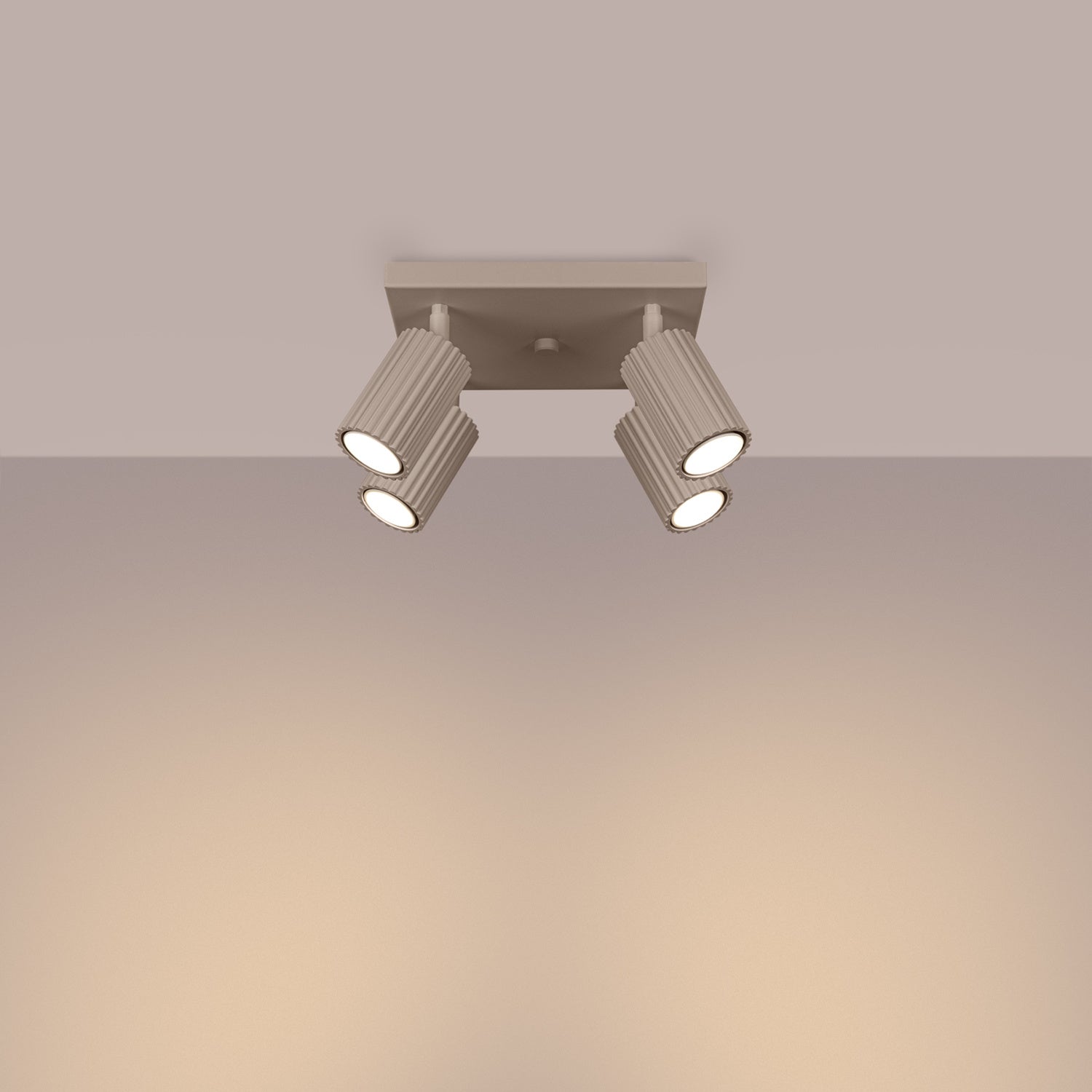 Taupe Quad Ribbed Spotlight Cluster switched on in modern UK home interior, warm LED glow