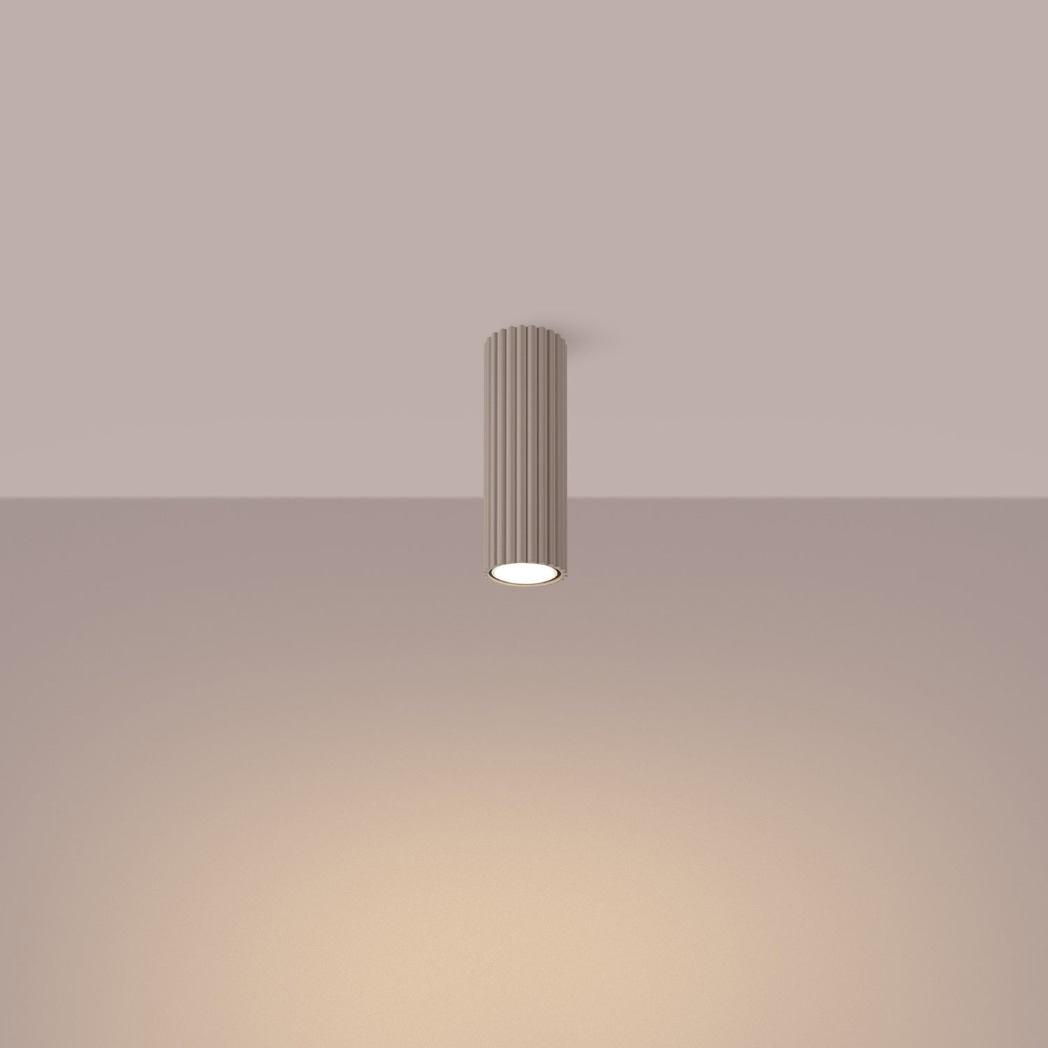 Taupe Ribbed Tube Ceiling Spotlight 20cm switched on in modern UK home interior, warm LED glow