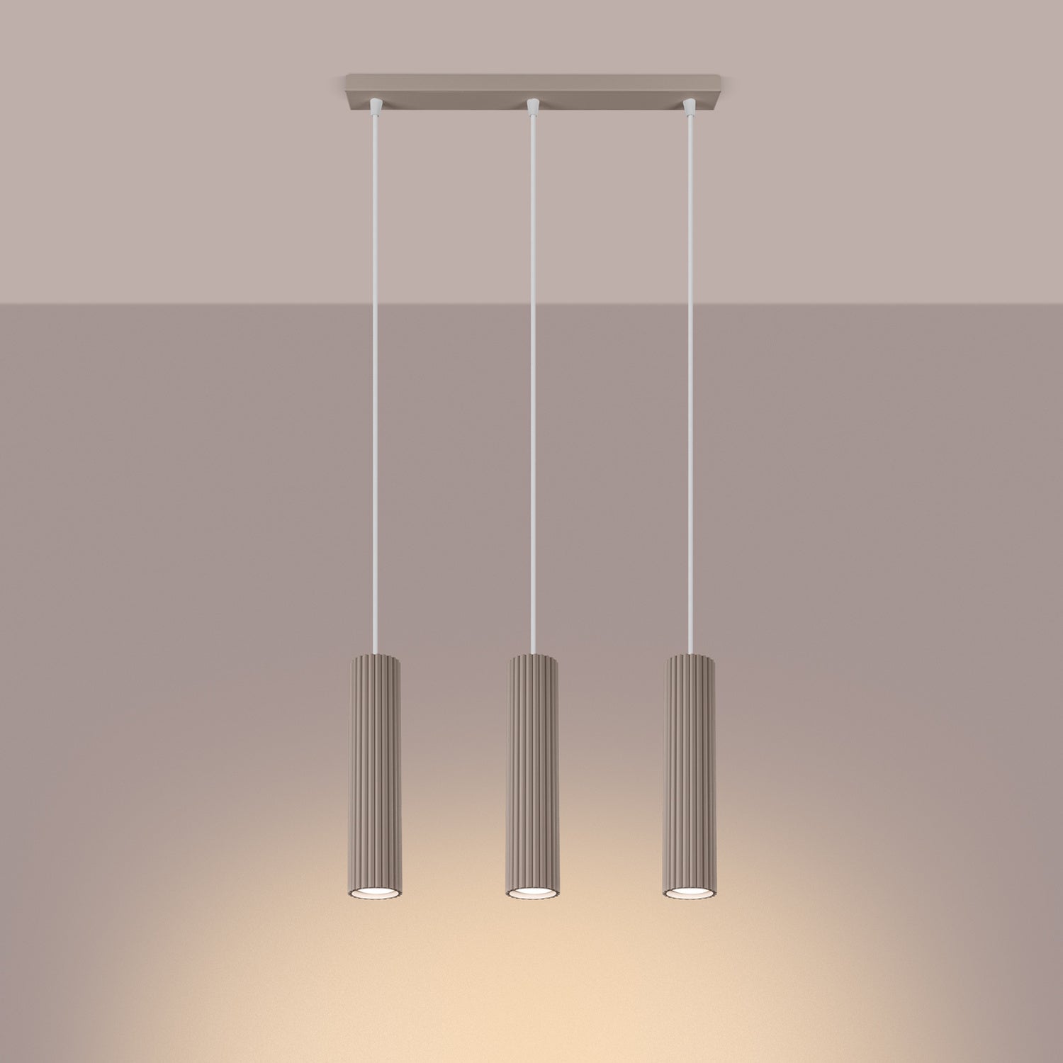 Taupe Triple Ribbed Pendant Bar switched on in modern UK home interior, warm LED glow