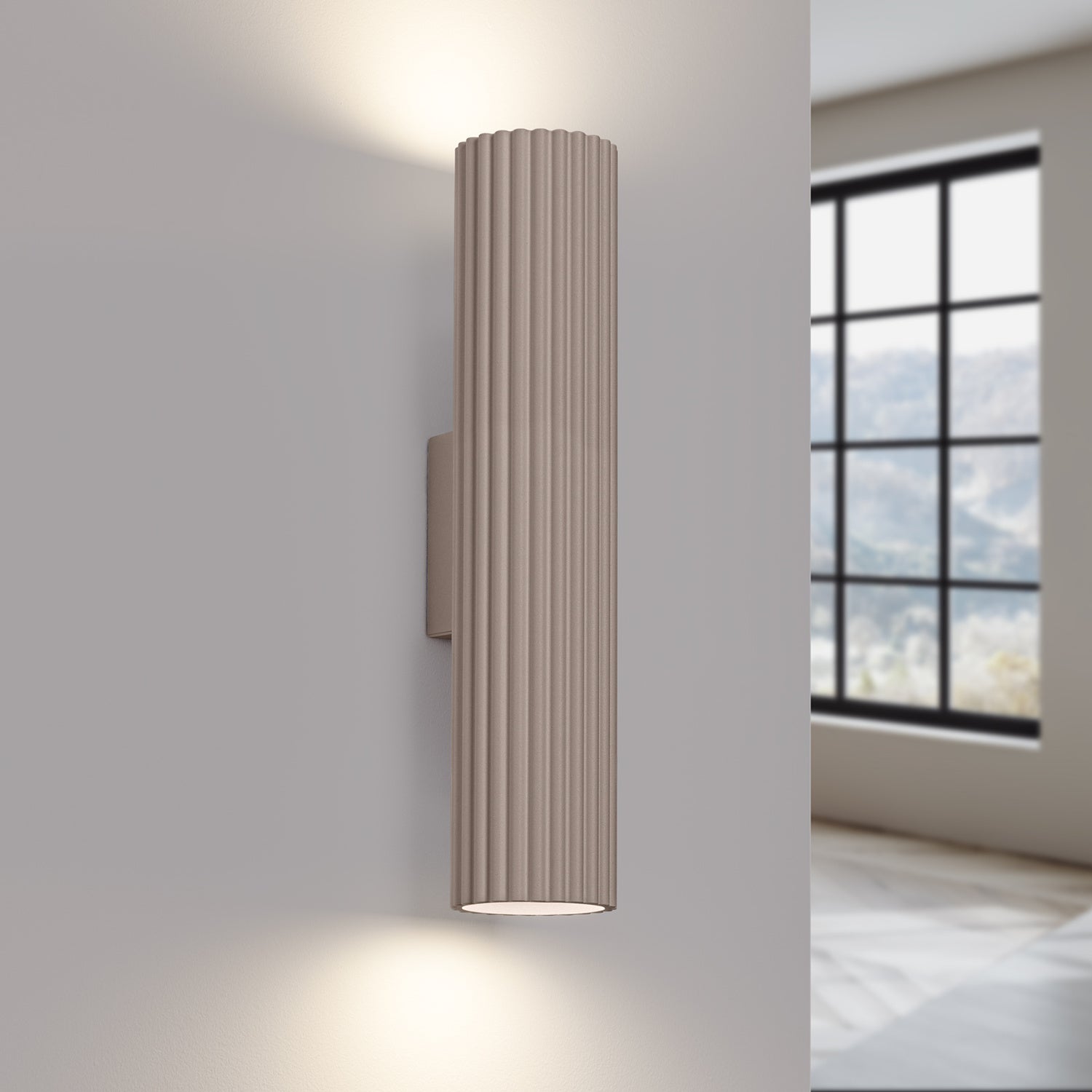 Taupe Twin Ribbed Wall Light Up Down switched on in modern UK home interior, warm LED glow