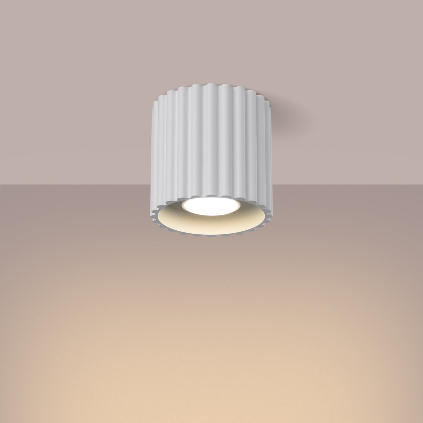 White Square Cube Surface Spotlight switched on in modern UK home interior, warm LED glow
