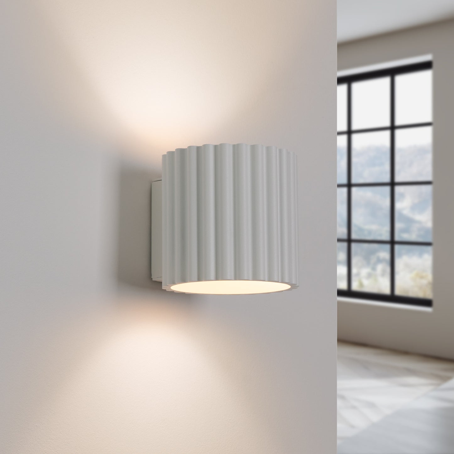 White Square Up Down Wall Light switched on in modern UK home interior, warm LED glow