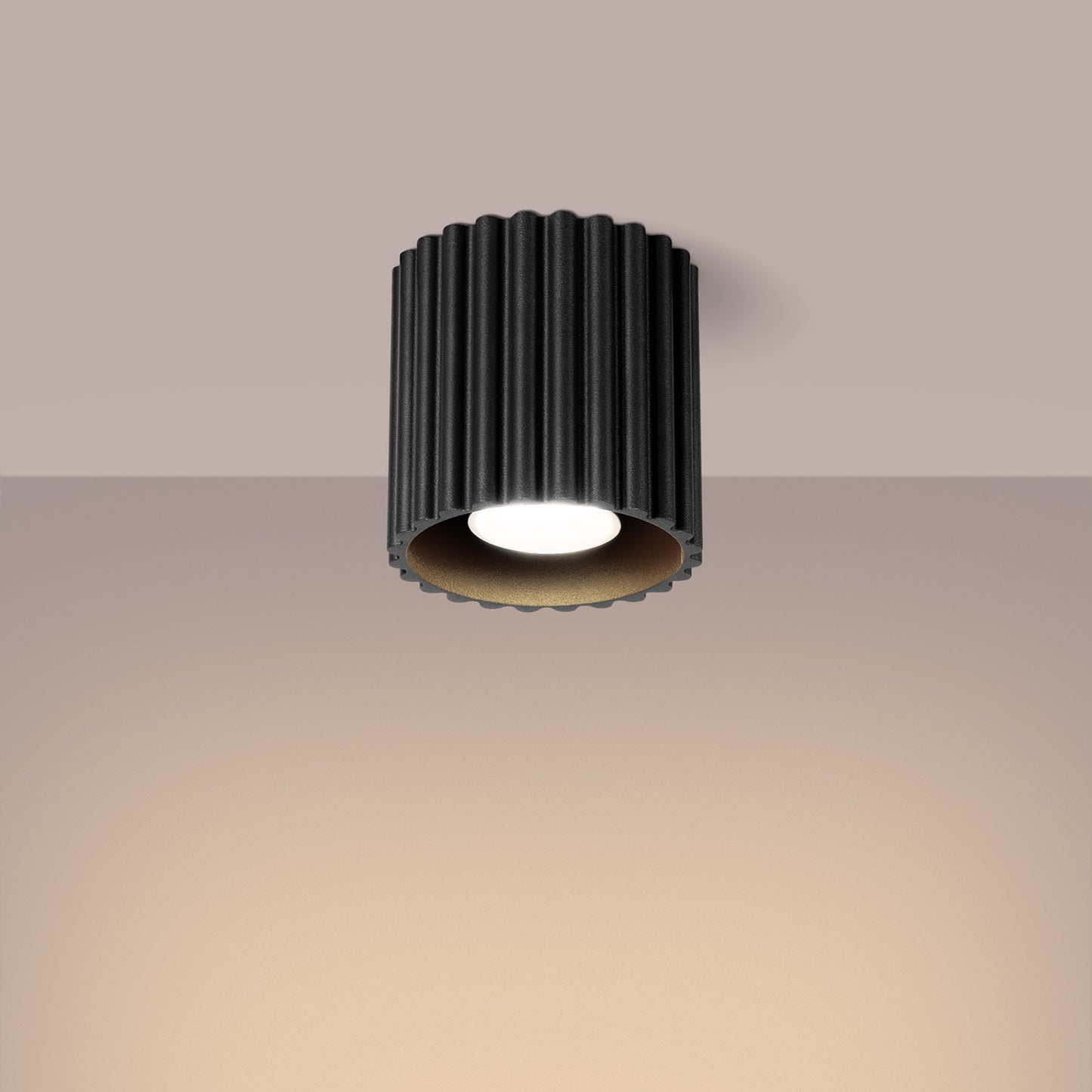 Black Square Cube Surface Spotlight switched on in modern UK home interior, warm LED glow
