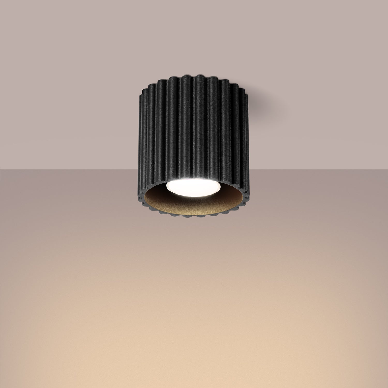 Black Square Cube Surface Spotlight switched on in modern UK home interior, warm LED glow