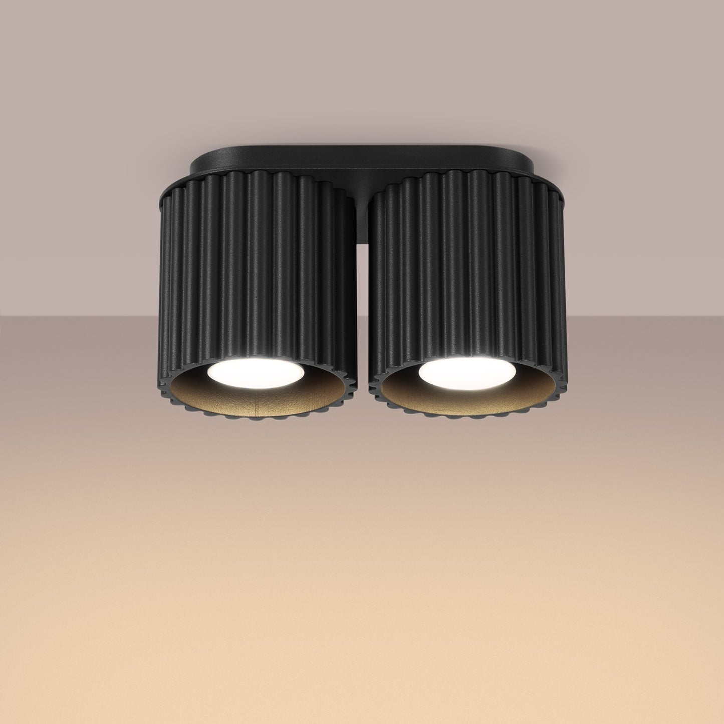 Black Twin Cube Surface Spotlight Bar switched on in modern UK home interior, warm LED glow