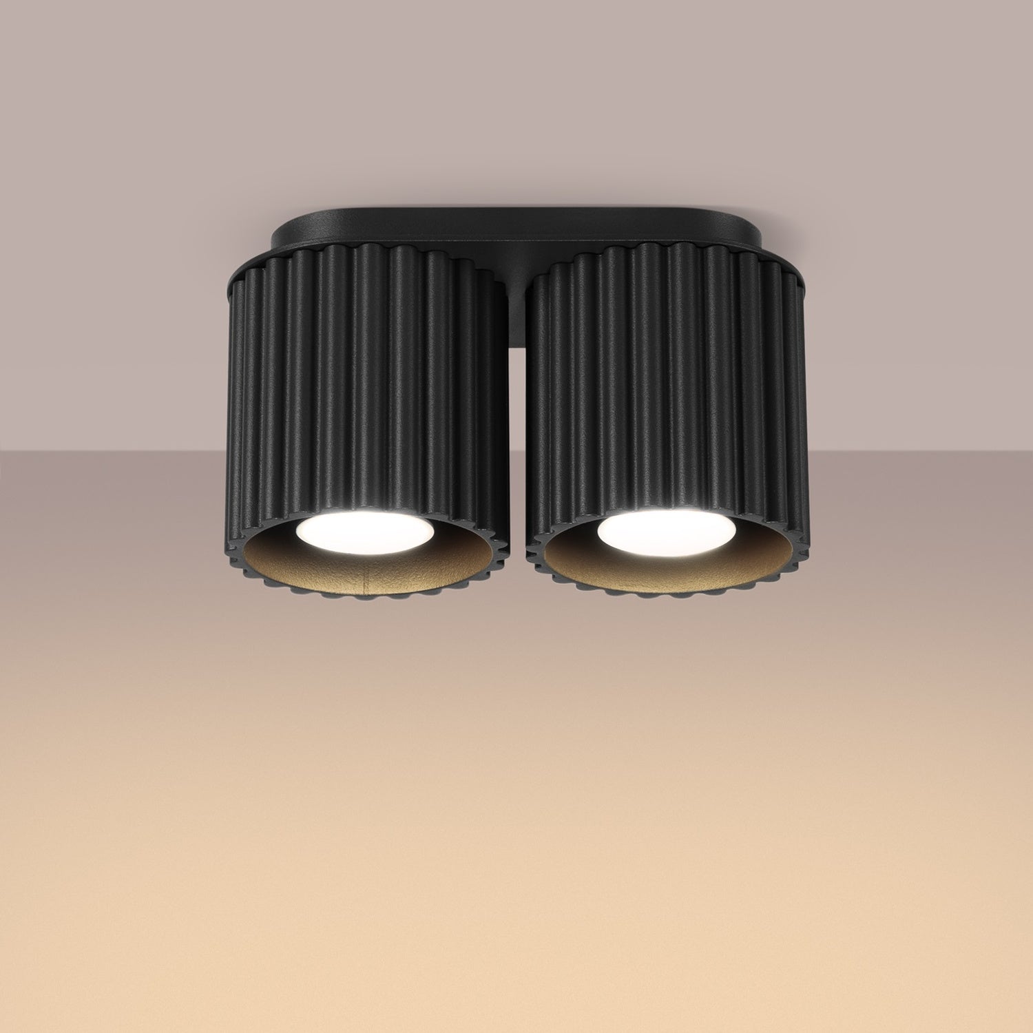 Black Twin Cube Surface Spotlight Bar switched on in modern UK home interior, warm LED glow
