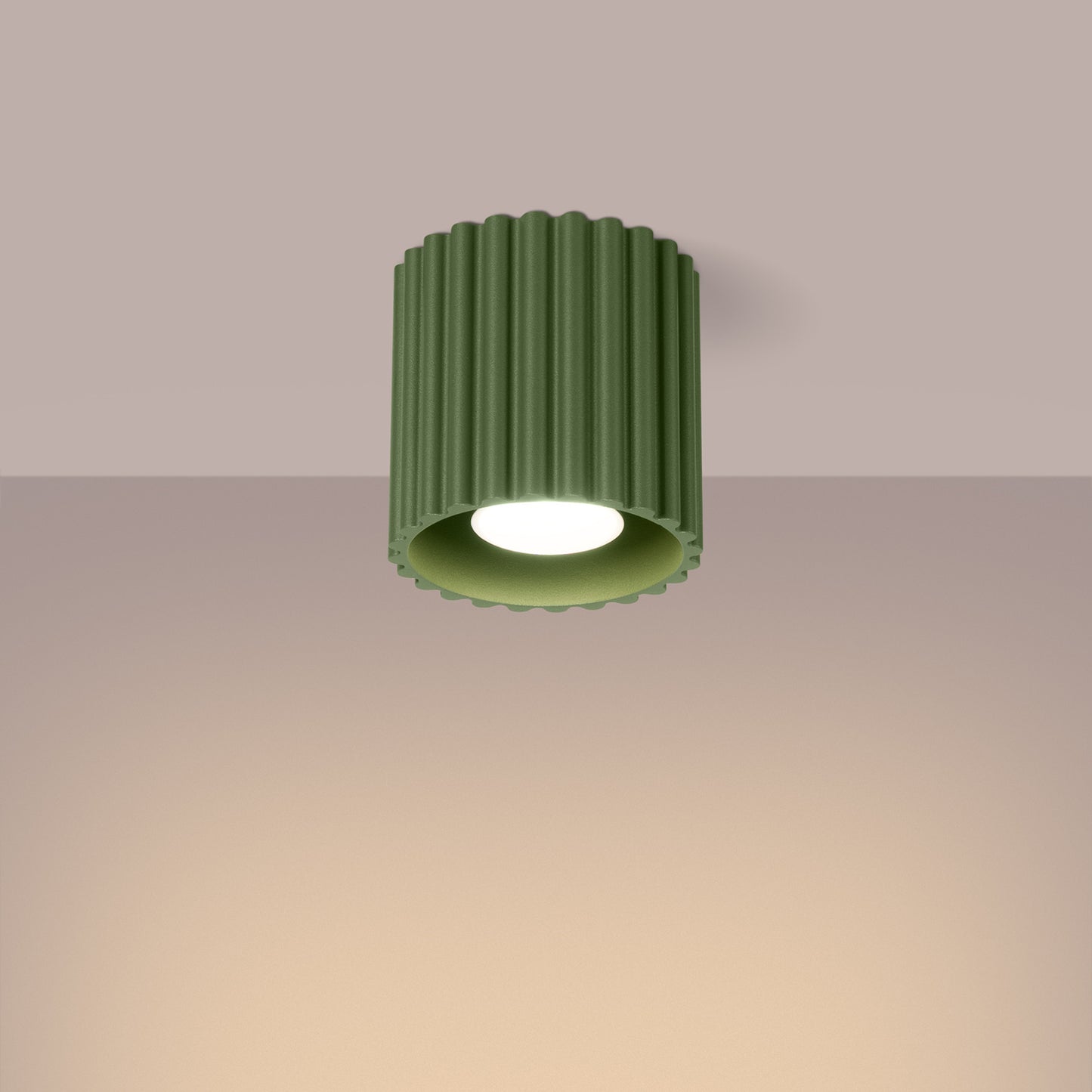 Olive Green Square Cube Surface Spotlight switched on in modern UK home interior, warm LED glow