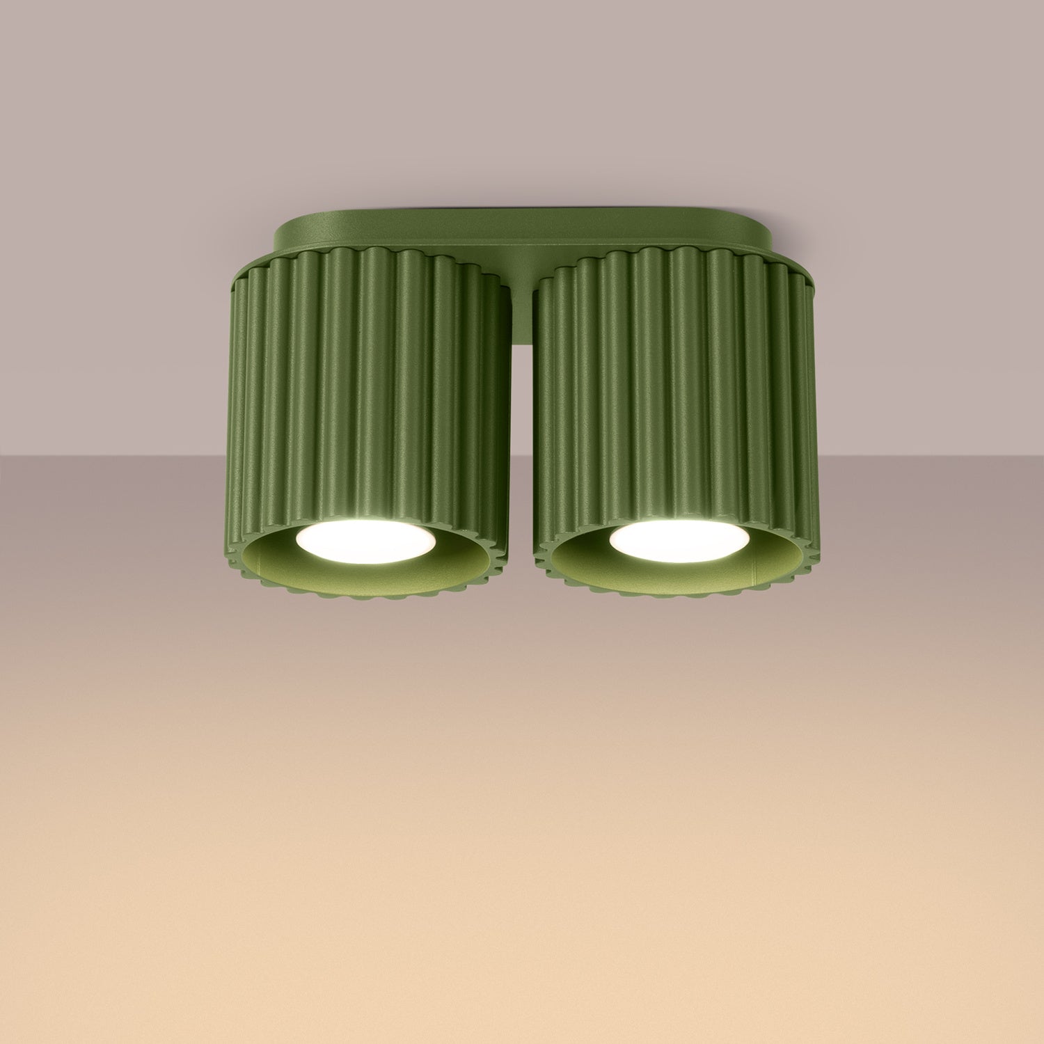 Olive Green Twin Cube Surface Spotlight Bar switched on in modern UK home interior, warm LED glow