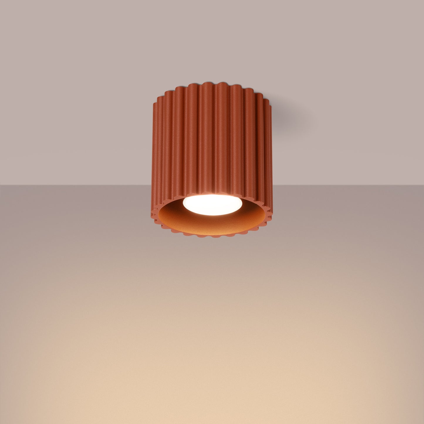 Red Ochre Square Cube Surface Spotlight switched on in modern UK home interior, warm LED glow