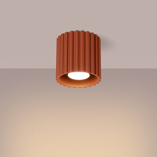 Red Ochre Square Cube Surface Spotlight switched on in modern UK home interior, warm LED glow