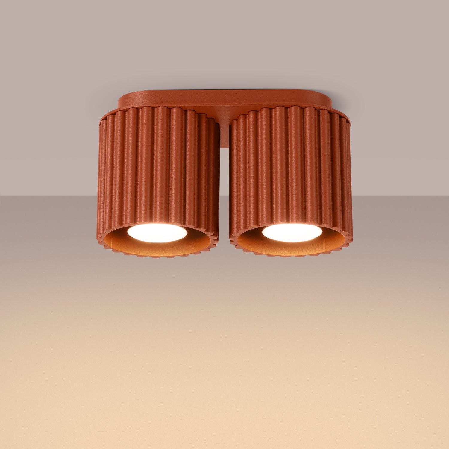Red Ochre Twin Cube Surface Spotlight Bar switched on in modern UK home interior, warm LED glow