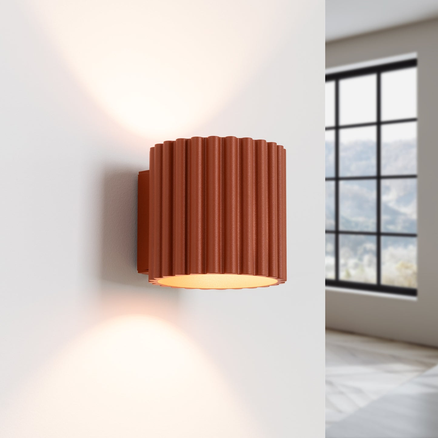 Red Ochre Square Up Down Wall Light switched on in modern UK home interior, warm LED glow
