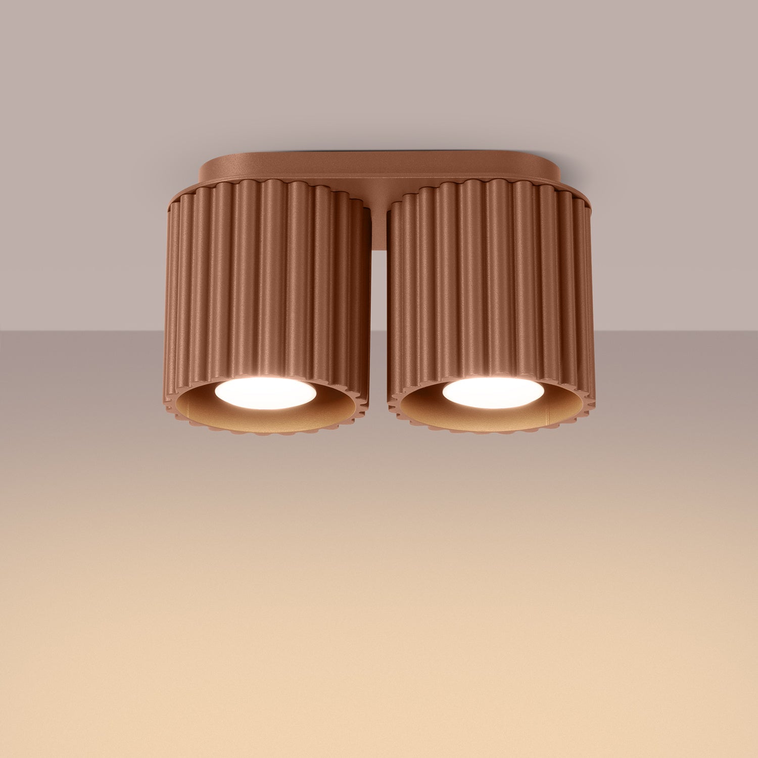 Mocha Twin Cube Surface Spotlight Bar switched on in modern UK home interior, warm LED glow