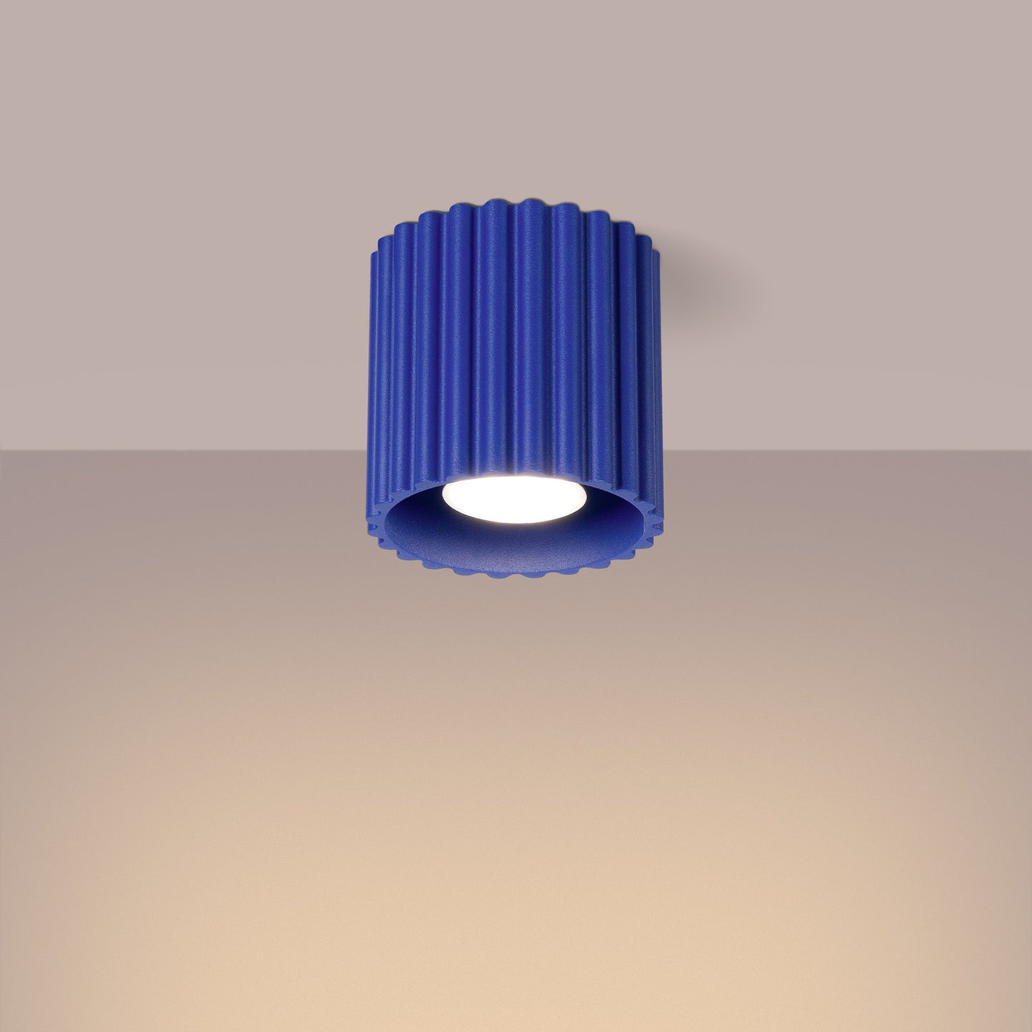 Ultramarine Square Cube Surface Spotlight switched on in modern UK home interior, warm LED glow