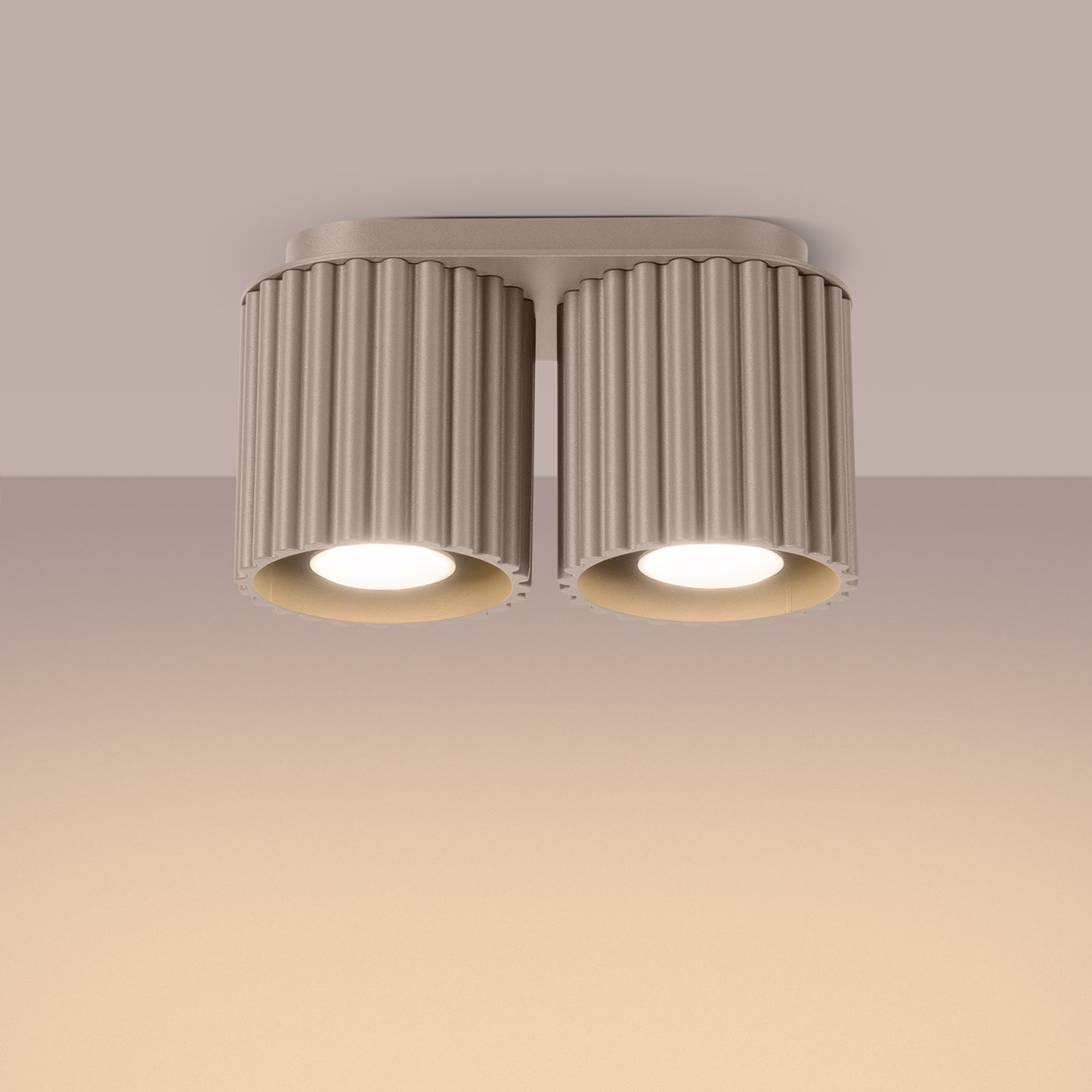 Taupe Twin Cube Surface Spotlight Bar switched on in modern UK home interior, warm LED glow