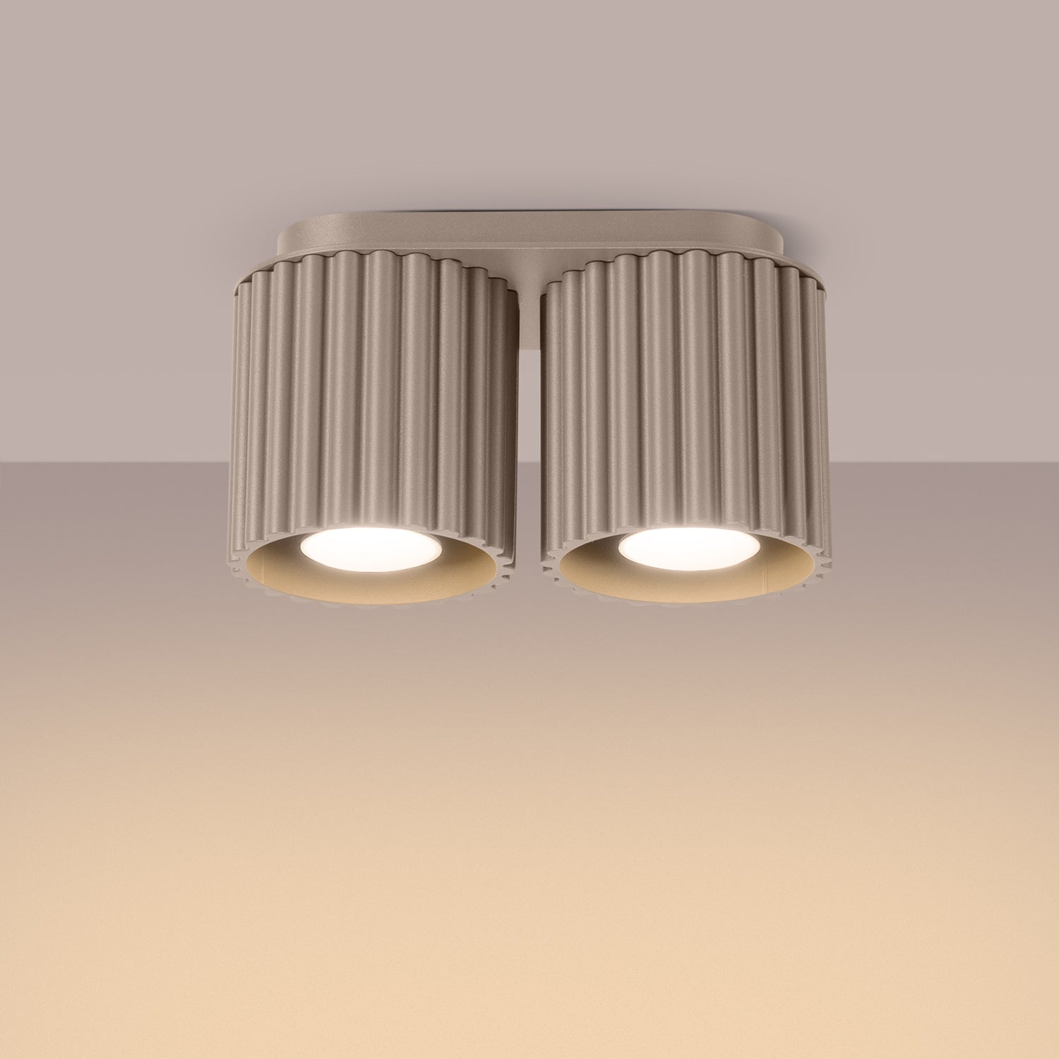 Taupe Twin Cube Surface Spotlight Bar switched on in modern UK home interior, warm LED glow