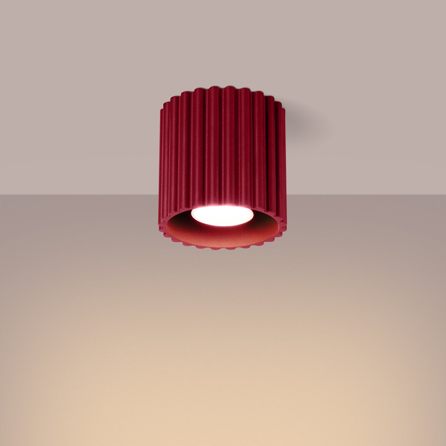 Burgundy Square Cube Surface Spotlight switched on in modern UK home interior, warm LED glow