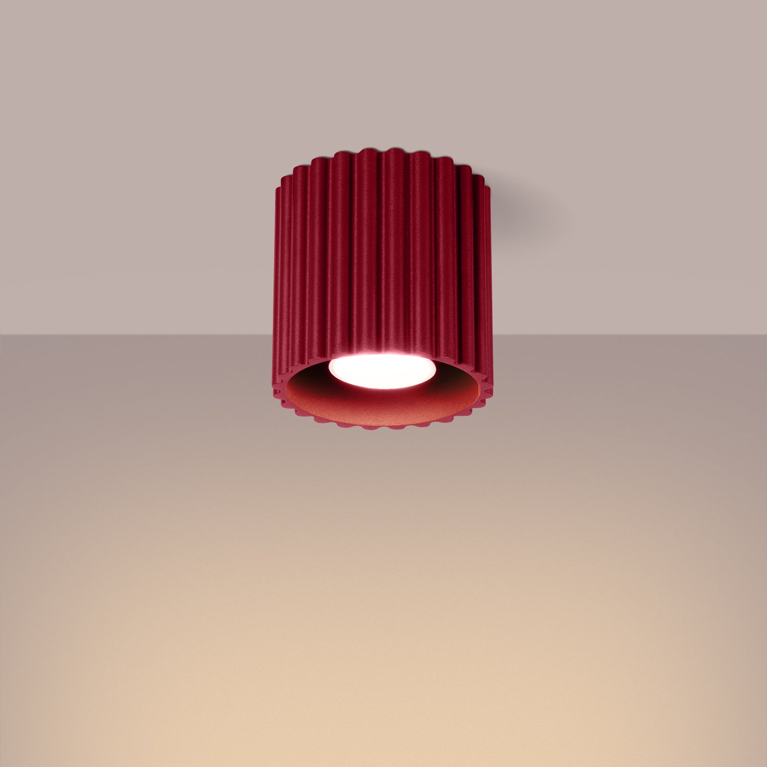 Burgundy Square Cube Surface Spotlight switched on in modern UK home interior, warm LED glow