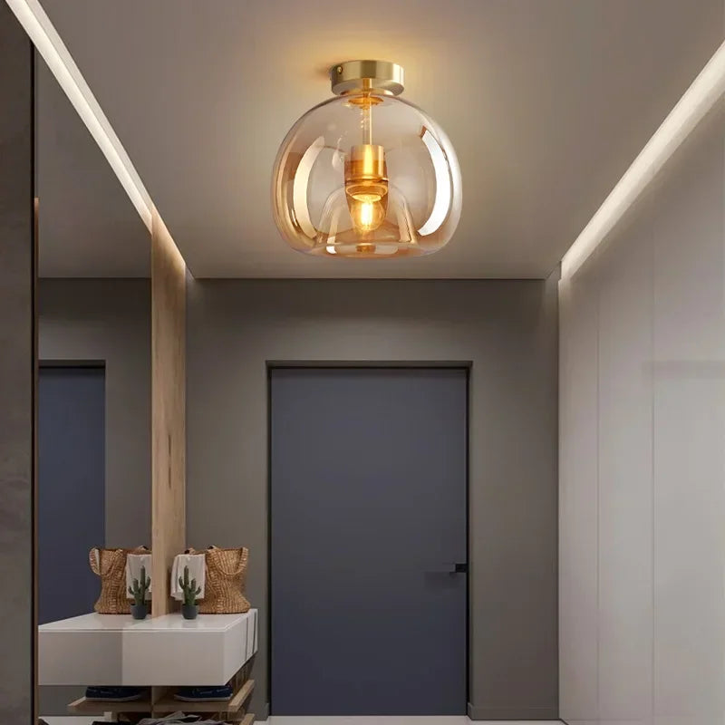 Gold glass ceiling light in a hallway
