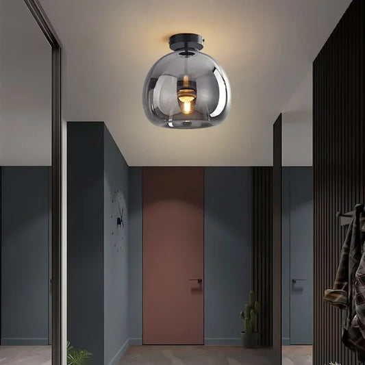Gold glass ceiling light in a hallway