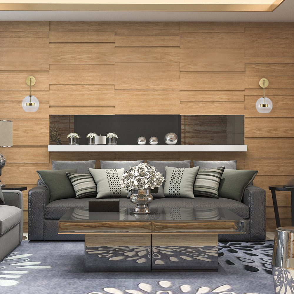 Gold Clear Globe L Arm Wall Light installed in modern UK home interior with warm LED glow, contemporary lighting design
