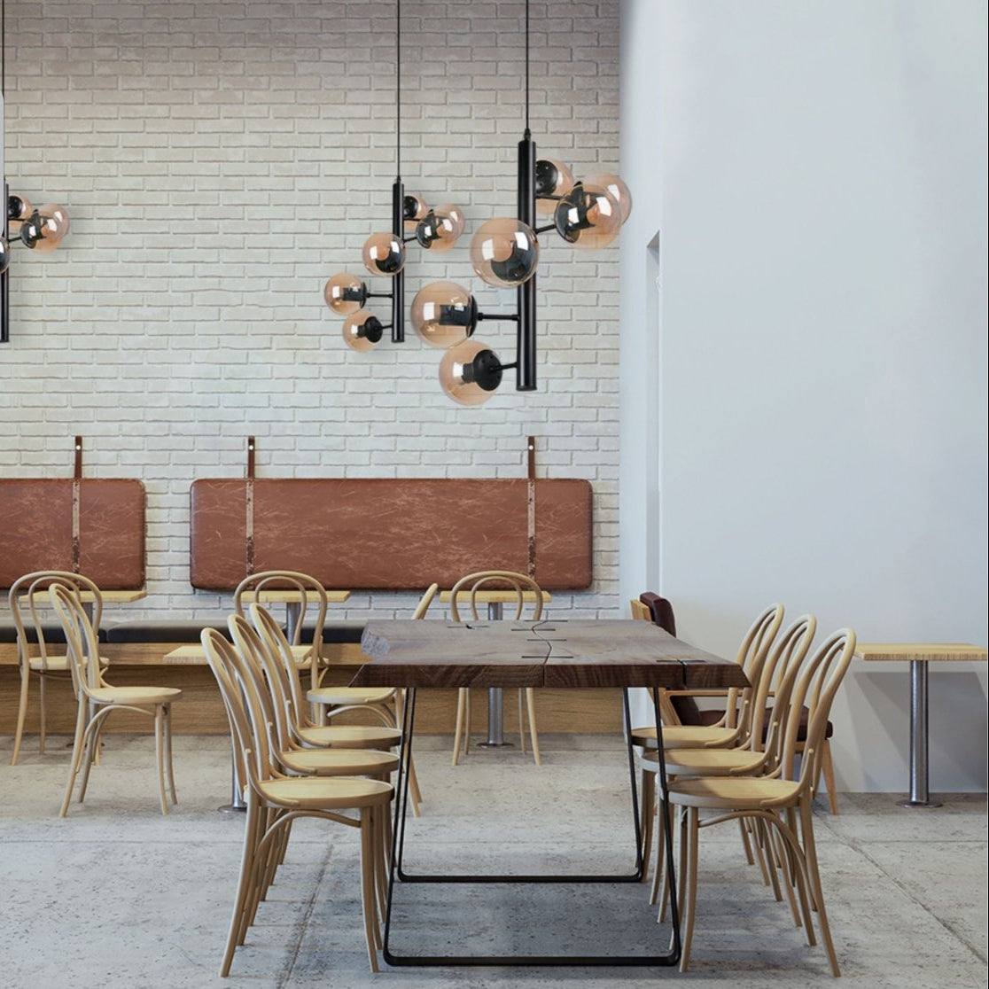 Black Spiral 6 Globe Sputnik Chandelier installed in modern UK home interior with warm LED glow, contemporary lighting design