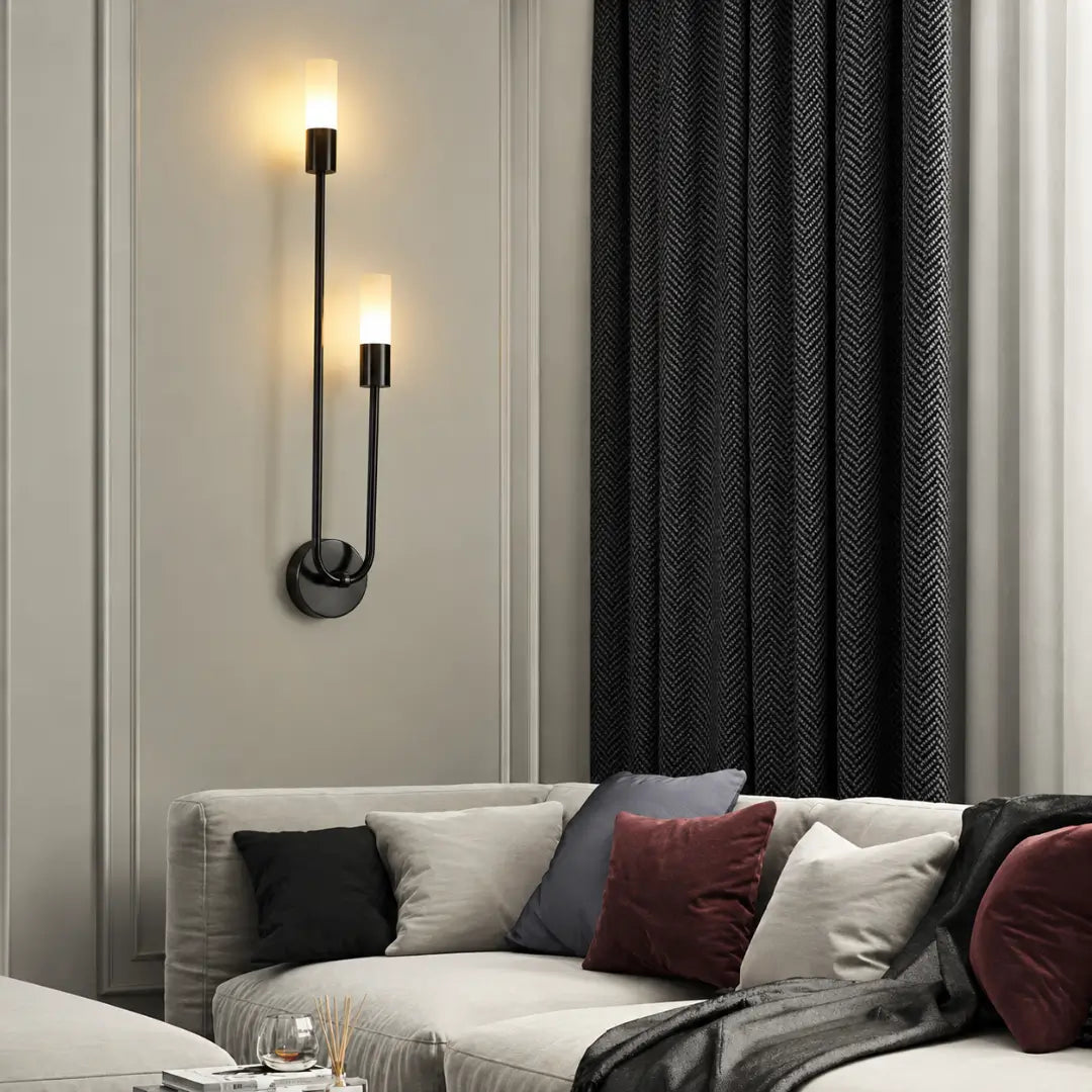 Brass cluster of amber glass globes lit on a wall