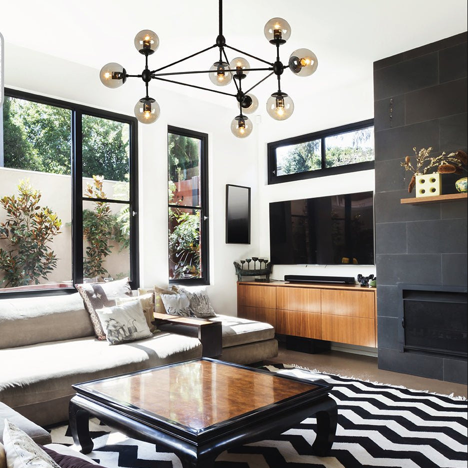 Black 10 Amber Globe Molecule Chandelier installed in modern UK home interior with warm LED glow, contemporary lighting design